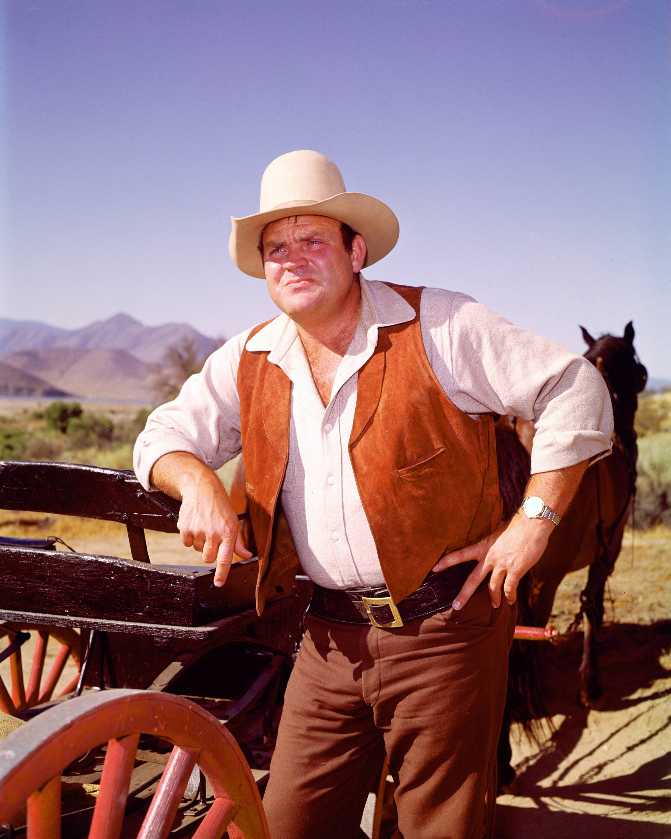 Actor Dan Blocker in costume as he leans against a cart, with a horse in the background, in a publicity portrait issued for the television series, 'Bonanza' in 970. |  Source: Silver Screen Collection/Getty Images 