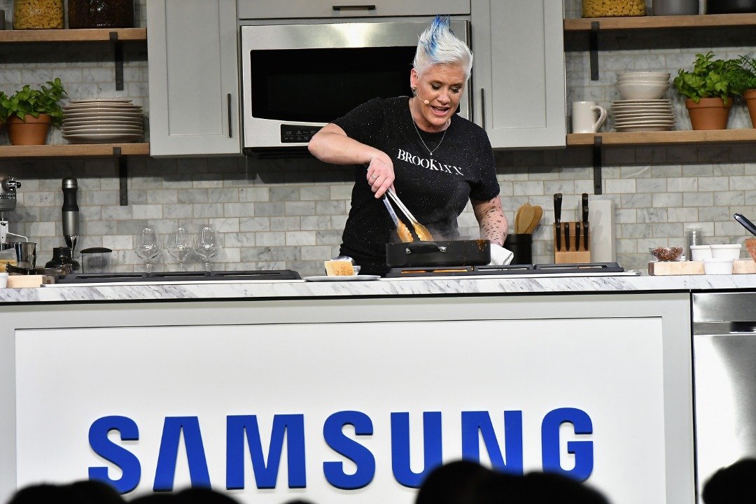   Anne Burrell prepares a plate at the Food Network & Cooking Channel New York City Wine & Food Festival presented by Coca-Cola grand tasting presented by ShopRite featuring Samsung® culinary demonstrations presented by Mastercard at Pier 94 on October 14, 2017. |  Source: Getty Images