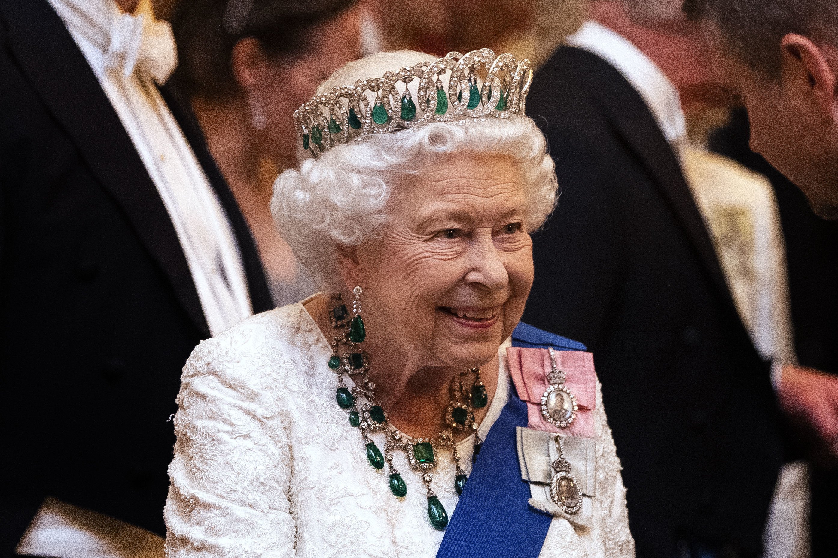 Queen Elizabeth II speaks to guests at an evening reception for members of the Diplomatic Corps at Buckingham Palace on December 11, 2019 in London, England.  |  Source: Getty Images