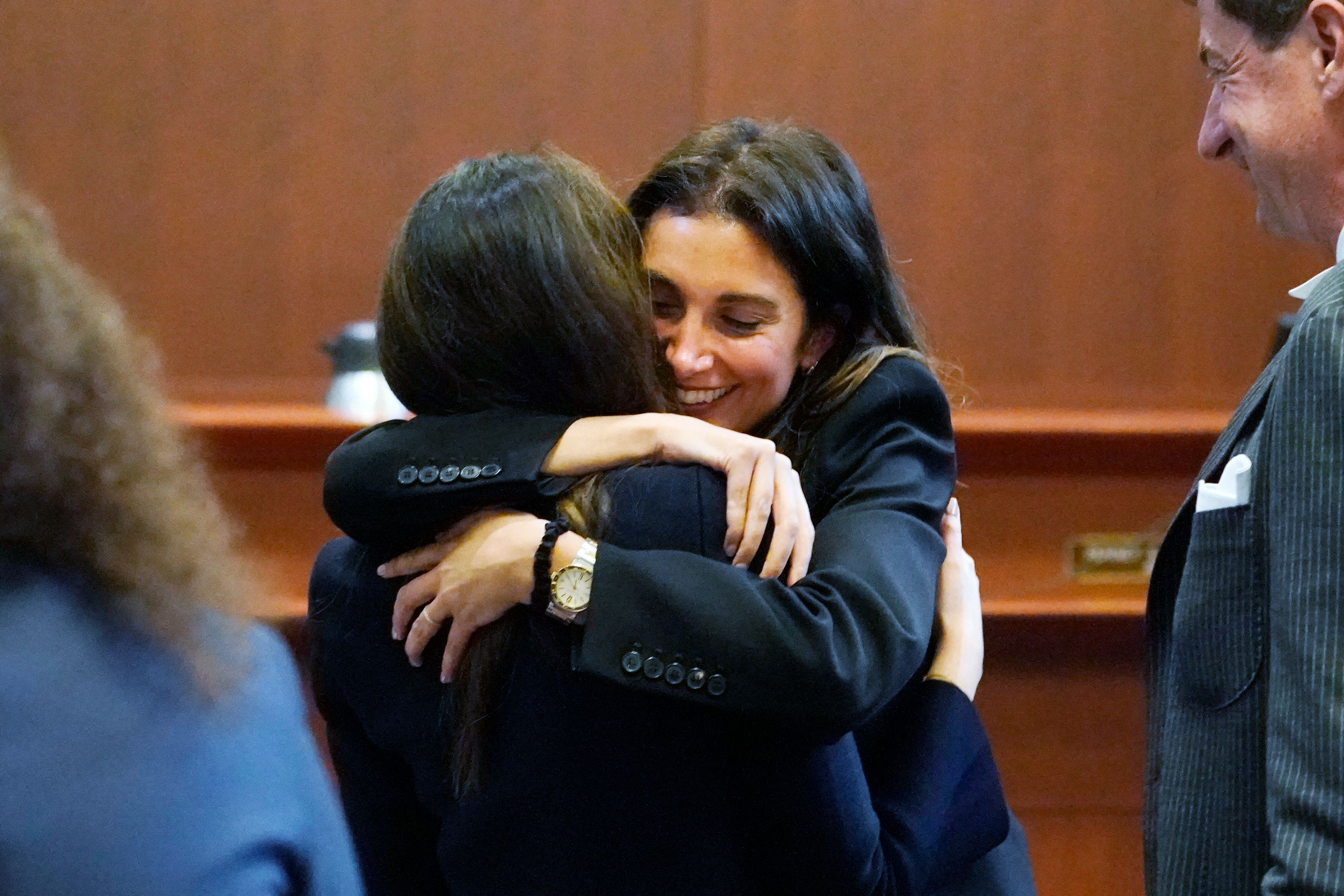 Attorney Joelle Rich hugs Attorney Camille Vasquez at the Fairfax County Circuit Courthouse on May 16, 2022 in Fairfax, Virginia.  |  Source: Getty Images