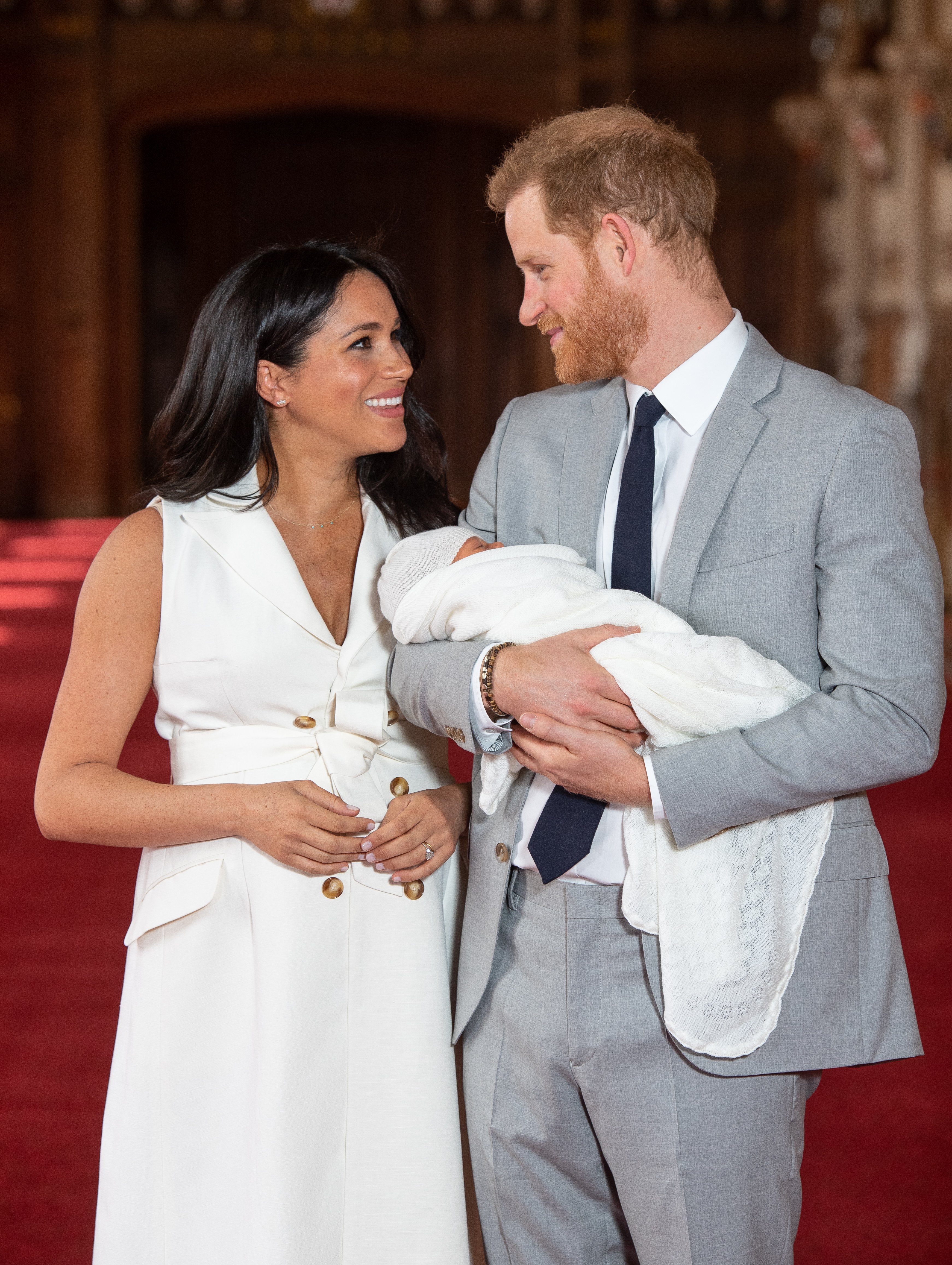 Prince Harry, Duke of Sussex and Meghan, Duchess of Sussex pose with their newborn son Archie Harrison Mountbatten-Windsor during a photo call at St George's Hall at Windsor Castle on May 8, 2019 in Windsor, England.  Source: Getty Images 