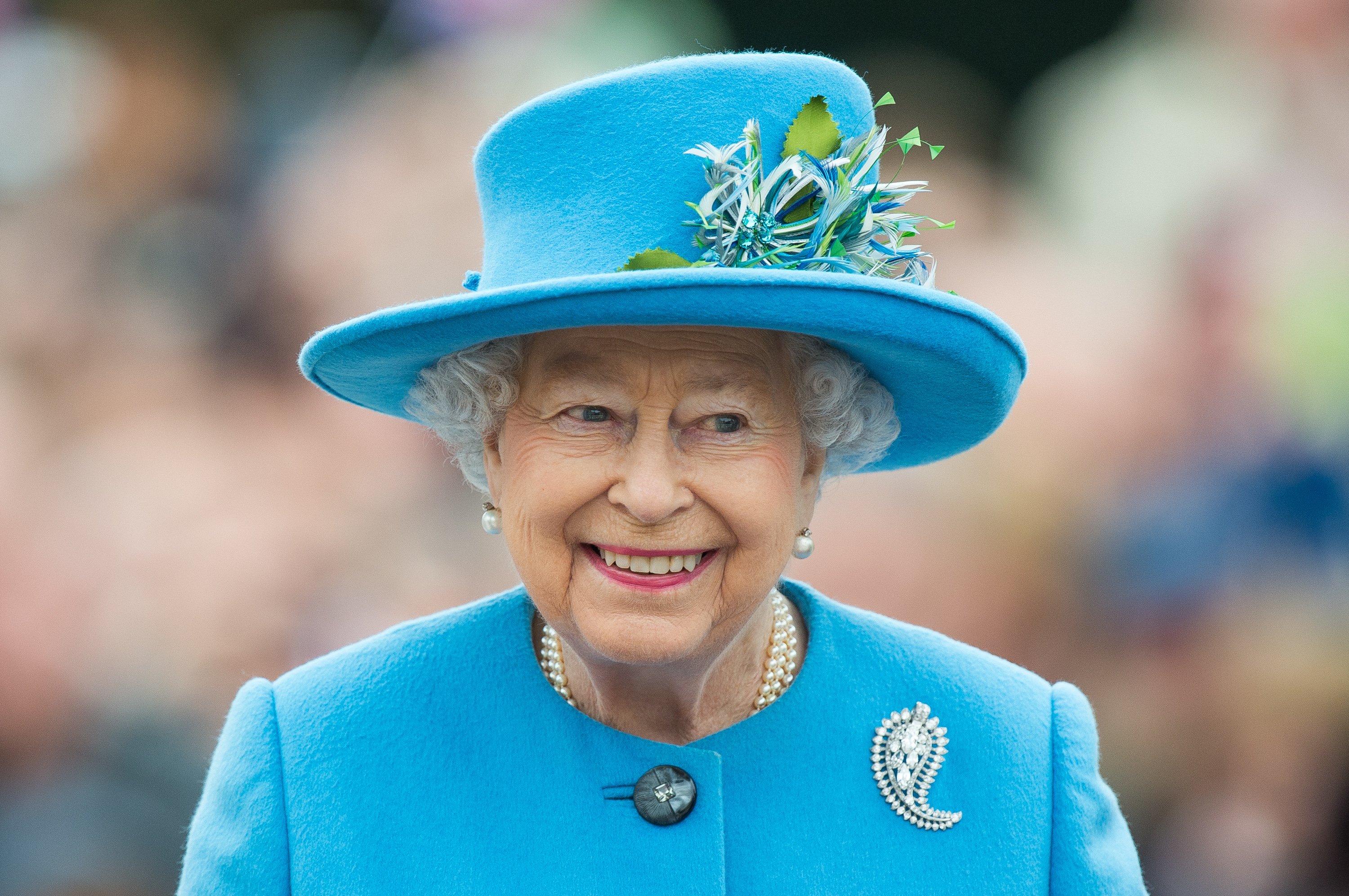 Queen Elizabeth II walks through Queen Mother Square on October 27, 2016 in Poundbury, Dorset.  |  Source: Getty Images