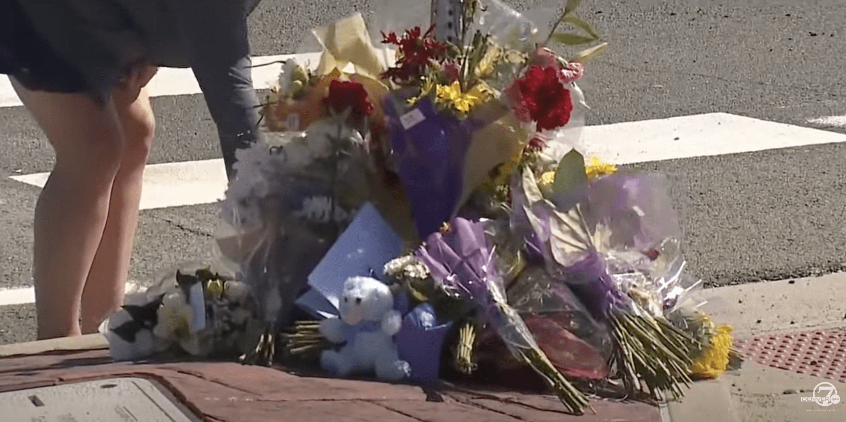 People leave flowers, stuffed toys and heartwarming notes for Austin in the median.  |  Source: YouTube.com/Denver 7 — The Denver Channel