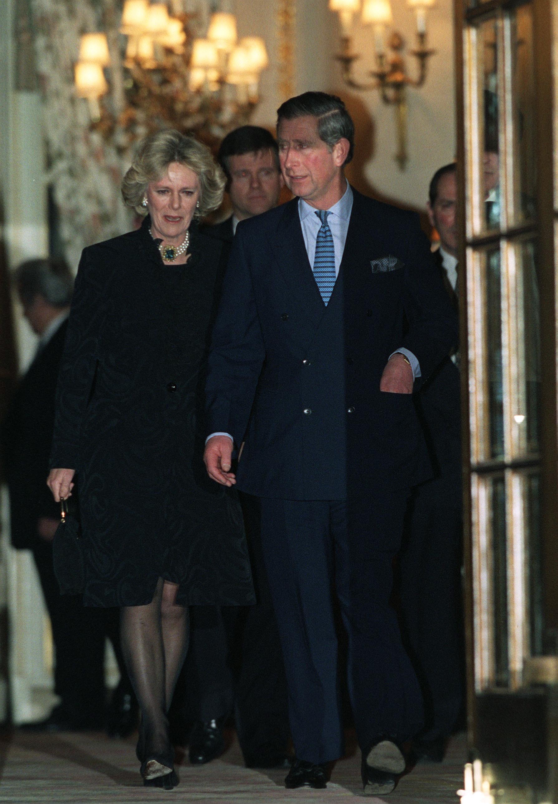 Prince Charles and Camilla Parker-Bowles leaving the Ritz Hotel in London after attending Camilla's sister's 50th birthday party on January 28, 1999 |  Source: Getty Images