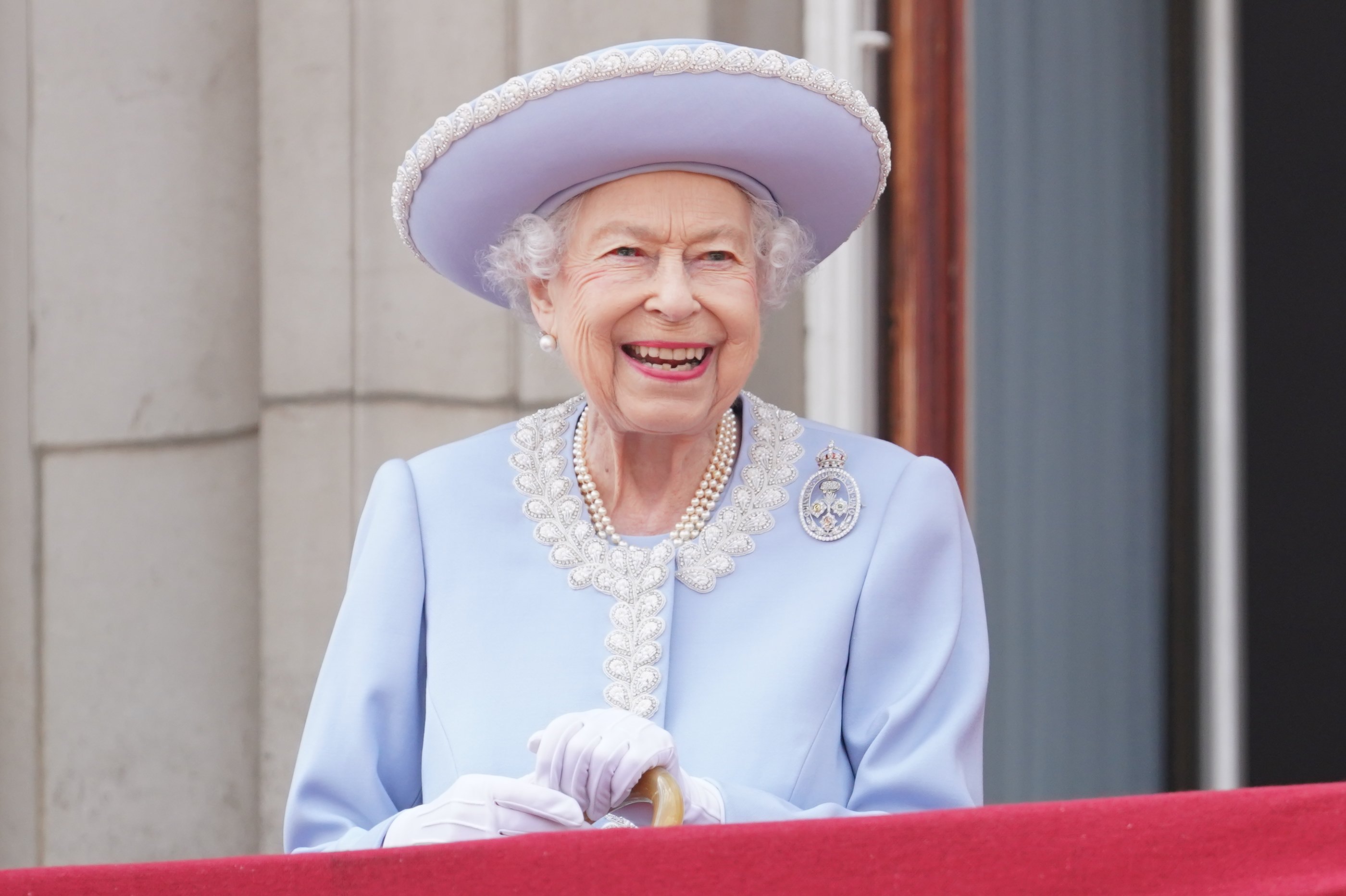 Queen Elizabeth II watches from the Buckingham Palace balcony during the Trooping the Color parade on June 2, 2022 in London, England.  |  Source: Getty Images